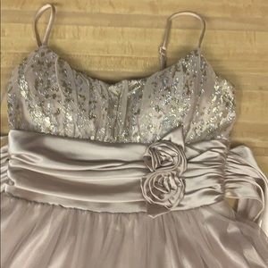 Cream and silver colored dress. B darlin